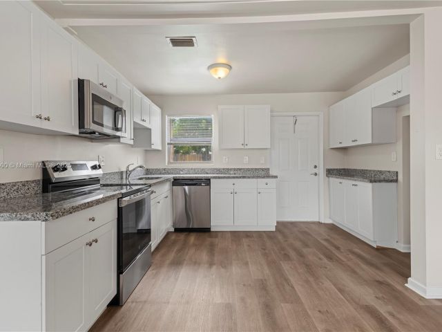 Home for sale at 2649 NE 14th Ter - photo 5881565