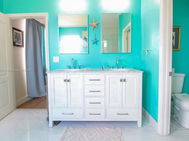 Home for sale at 1156 NE 37th Pl - photo 6036561