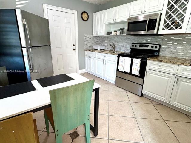 Home for rent at 5726 SW 20th St - photo 6156429