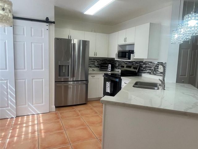 Home for rent at 1432 SW 47 Ave 1432 - photo 6192171