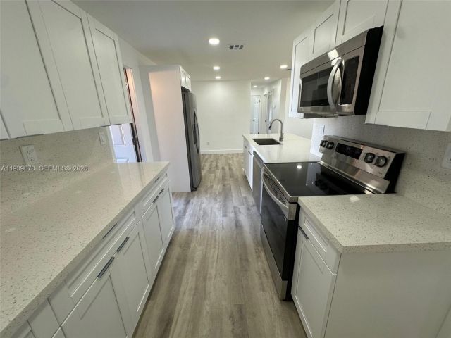 Home for sale at 1521 NE 43rd Ct - photo 6997630