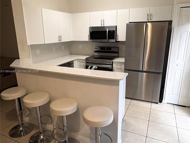 Home for rent at 10776 NW 84th Ln 8-30 - photo 7485486