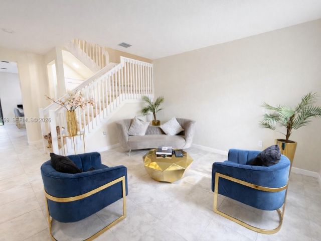 Home for rent at 323 NE 208th Ter 0 - photo 7449380