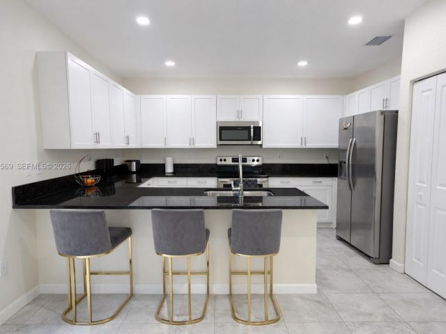 Home for rent at 323 NE 208th Ter 0 - photo 7449381