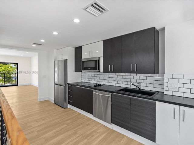 Home for rent at 1134 71st St 1 - photo 7469011