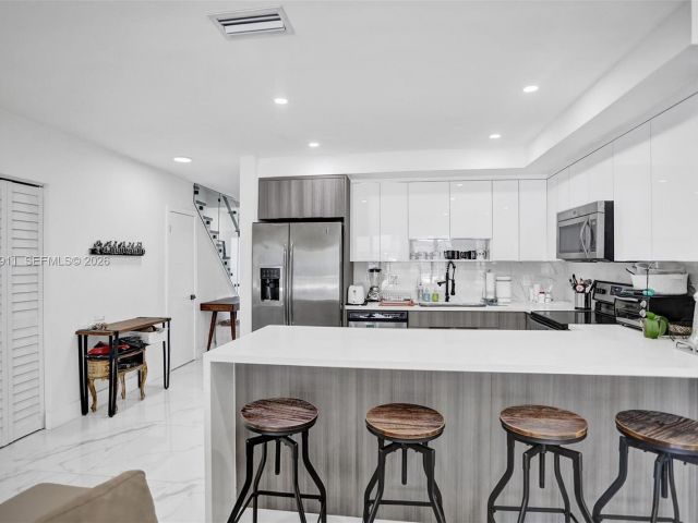 Home for rent at 3648 NE 167th St 27 - photo 7480985