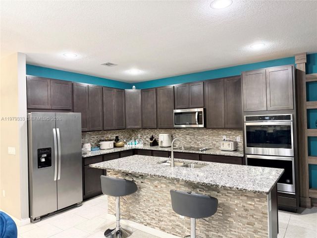 Home for rent at 445 NW 36th Ave - photo 7478506