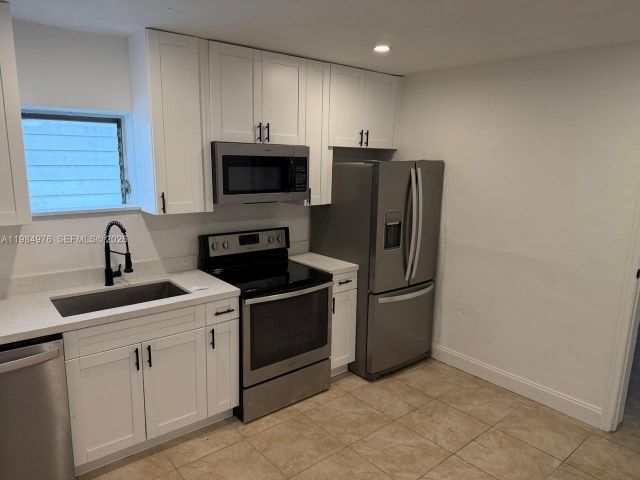 Home for rent at 2335 NW 68th St 1 FRONT - photo 7463345