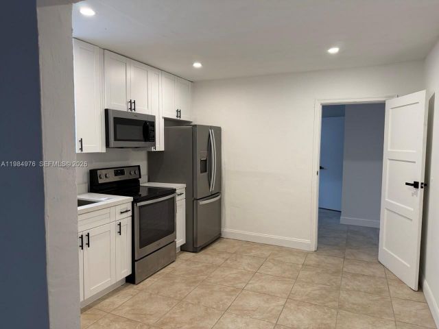 Home for rent at 2335 NW 68th St 1 FRONT - photo 7463356