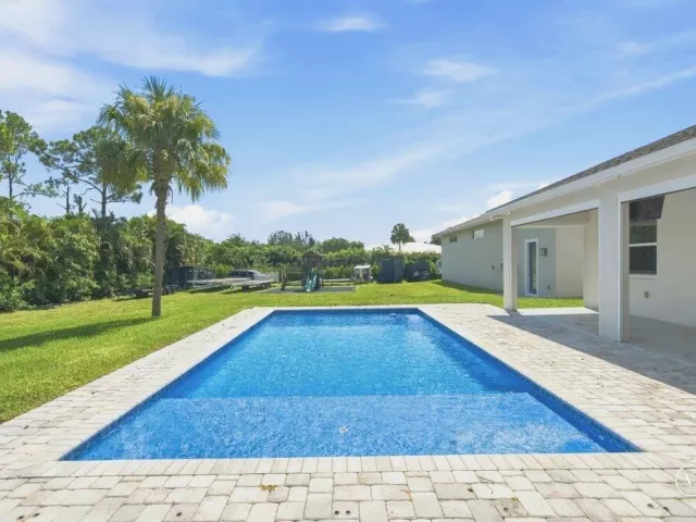 4-bedroom home for sale in West Palm Beach - 12291 70th Place N - MondialRealty