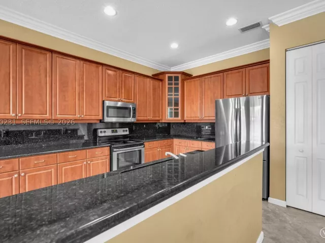 5-bedroom home for sale in West Palm Beach - 9345 Madewood Ct - MondialRealty